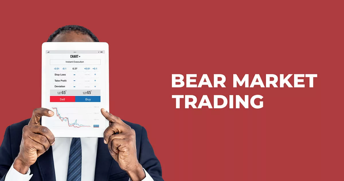 A trader in formal clothing holding a tablet which shows a bear market graph chart along with written text bear market trading.